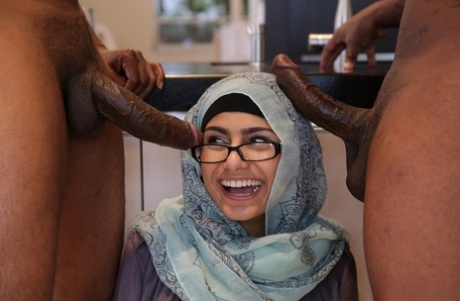 Geeky Lebanese pornstar Mia Khalifa fucking two large black cocks in a 3some