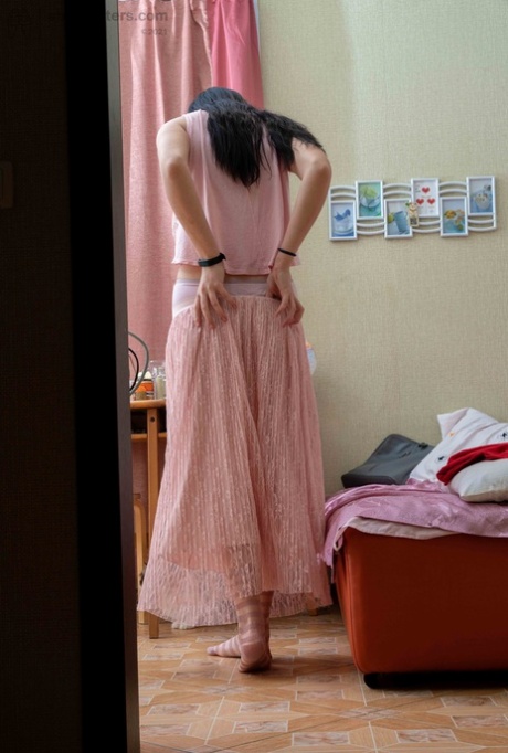 Tall brunette Elza flashing her tight ass & her large areolas while dressiing