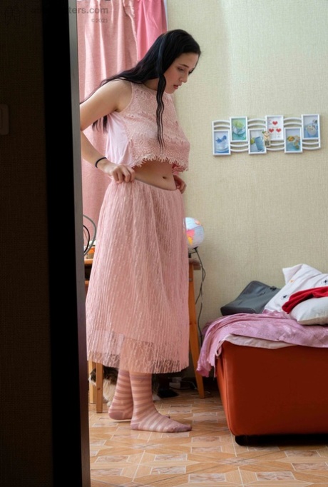 Tall brunette Elza flashing her tight ass & her large areolas while dressiing